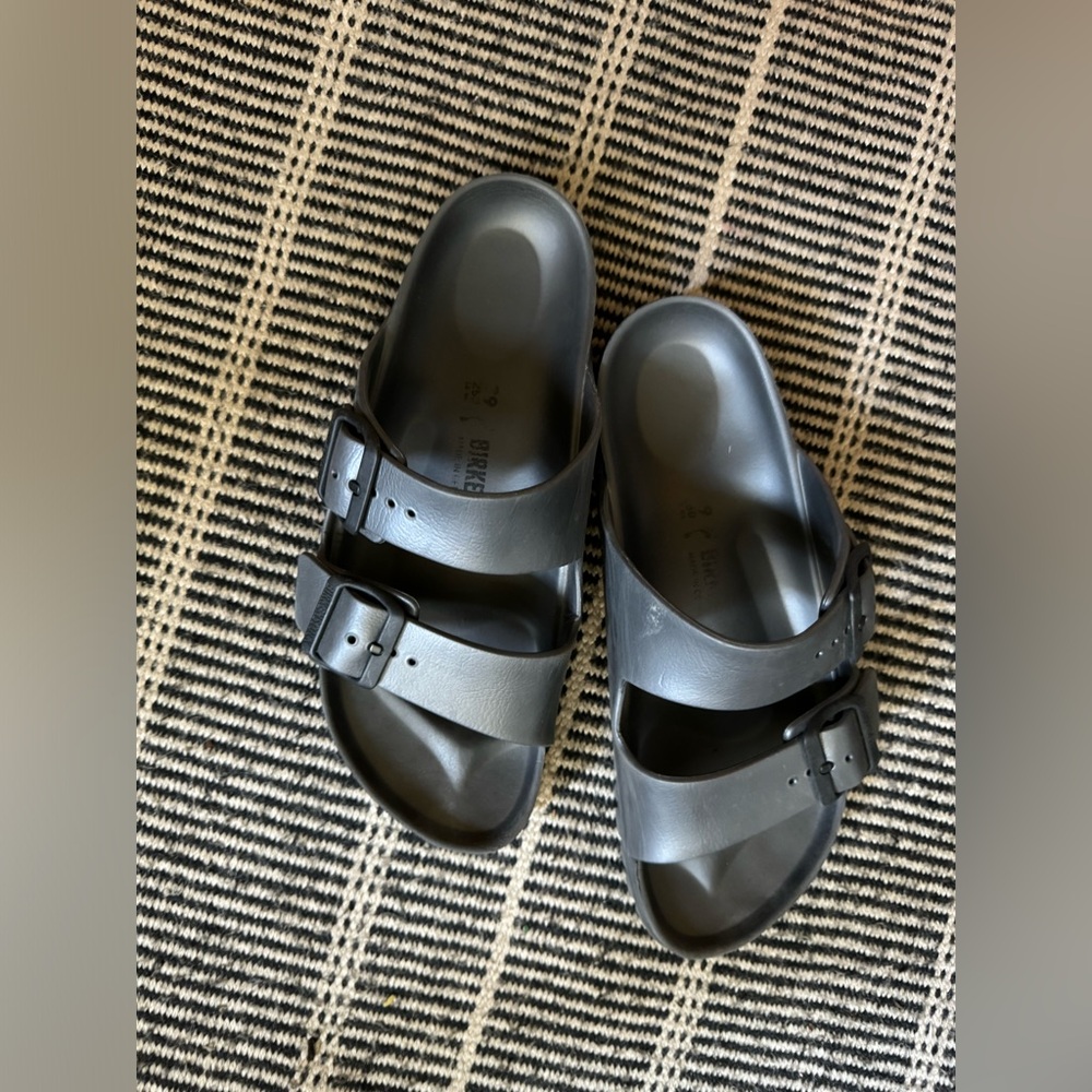 Birkenstock slides. Rubbery waterproof.